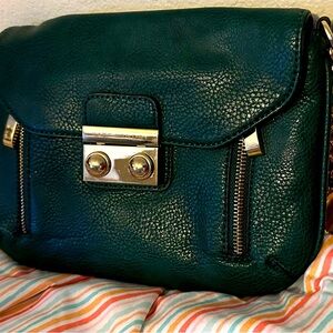 Vintage Kate Landry in olive green with contrast aqua interior. Textured surface